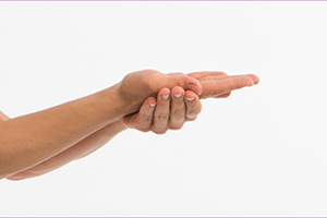 Person holding right hand palm up, with left hand cradling underneath