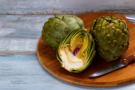 Cut artichokes on a serving plate